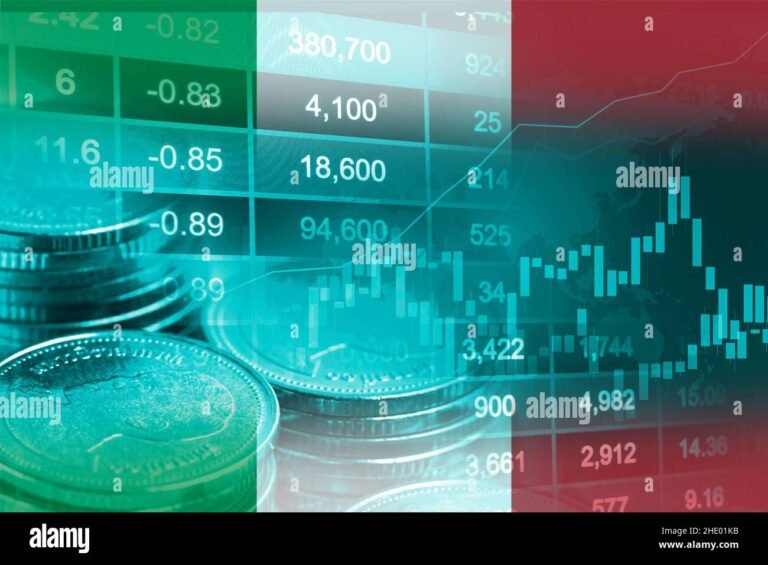 moneta italiana con grafico finanziario sfocato